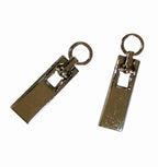 Pack of 10 small silver zip pulls with eyelets displayed