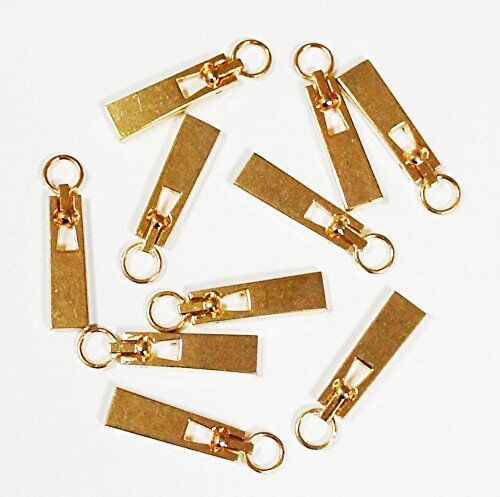 Close-up of a gold zip pull showing its eyelet and design details.