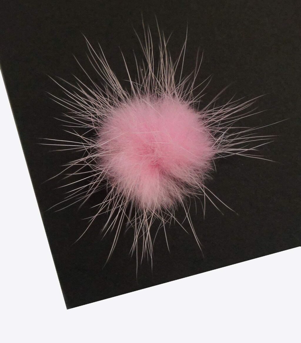 Close-up of PINK decorative mink pom pom trim