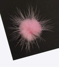 Close-up of PINK decorative mink pom pom trim