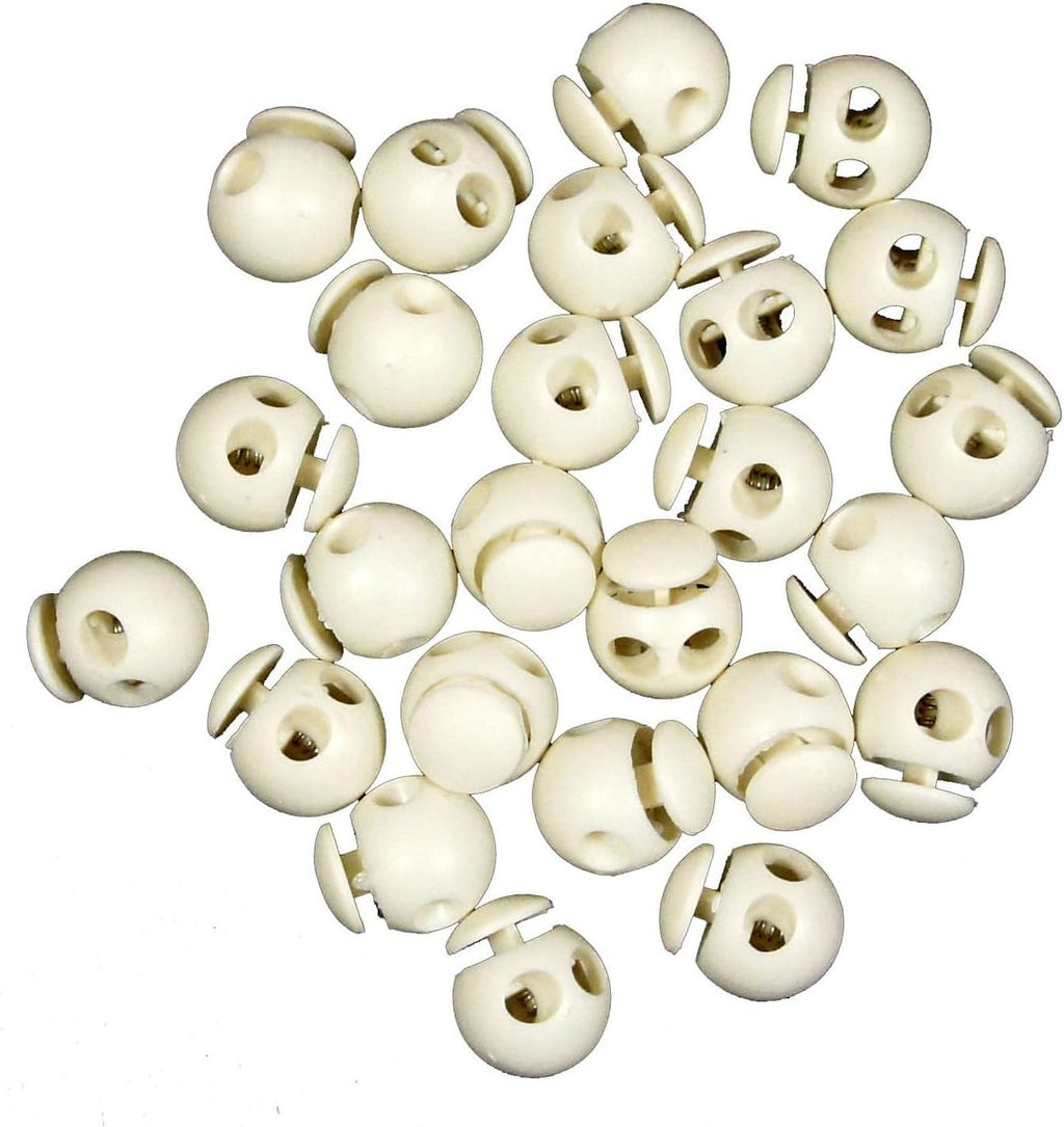 Close-up of white plastic round toggle spring cord locks showing double holes.