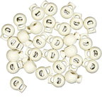 Close-up of assorted sizes of white plastic cord locks.