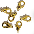 Close-up of gold lobster claw clasps suitable for necklaces and bracelets.