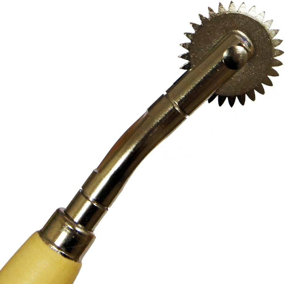 Close-up of serrated edge on tracing wheel for precise marking