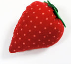 Close-up of a strawberry pin cushion showing its vibrant colour.