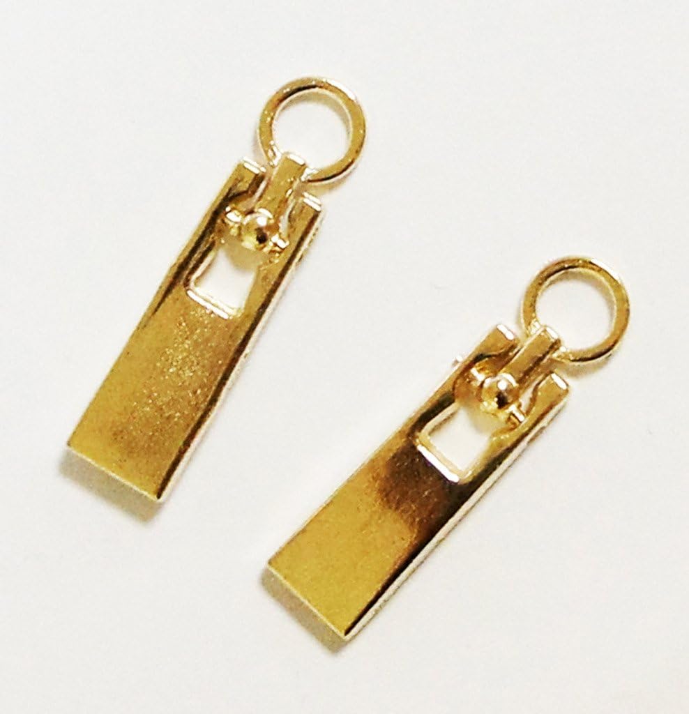 Close-up of gold small zip pulls showcasing the eyelet detail.