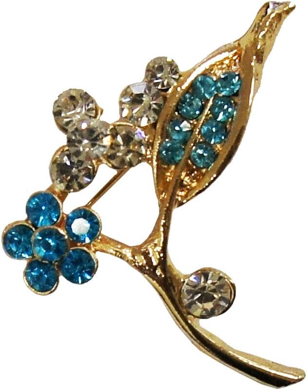 Close-up of a gold tone brooch featuring a colourful gemstone flower design.