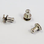 Binding screws displayed on a craft table