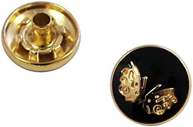 Close-up of a decorative gold and black butterfly press stud.