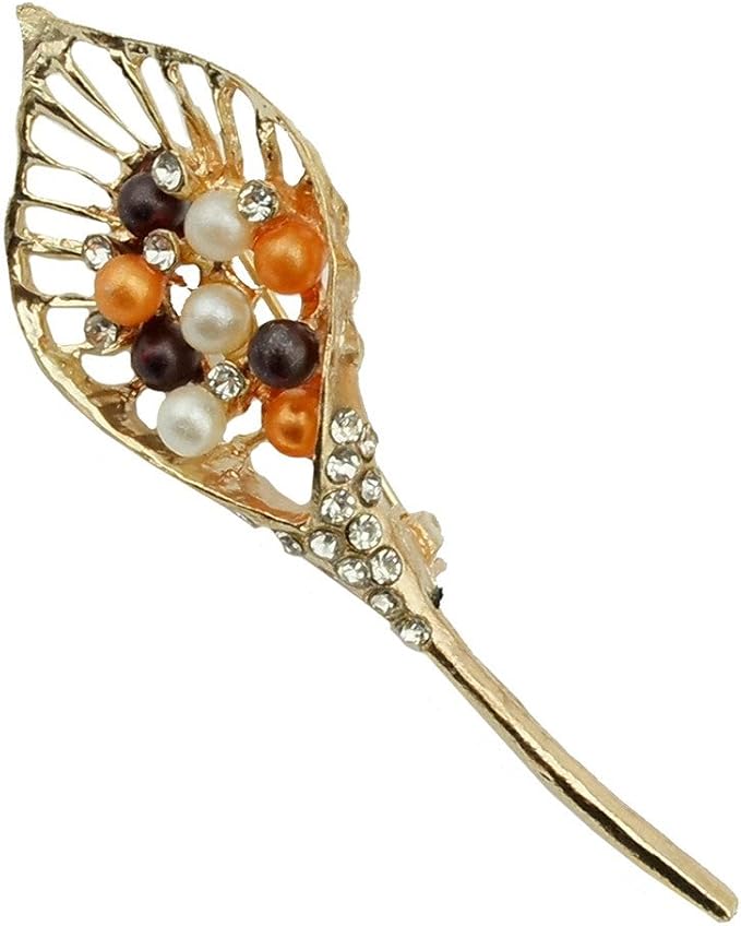 Close-up of elegant rhinestone leaf brooch in gold tone.