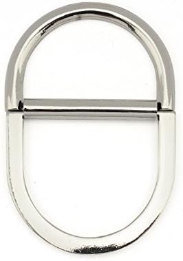 D-ring buckle alongside sewing tools for crafting