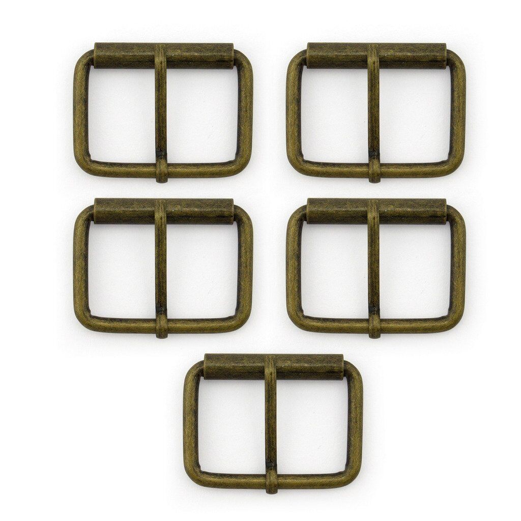 Large antique gold metal belt buckle on a white background.