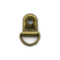 Pack of 20 antique gold metal shoe lace eyelets on display.