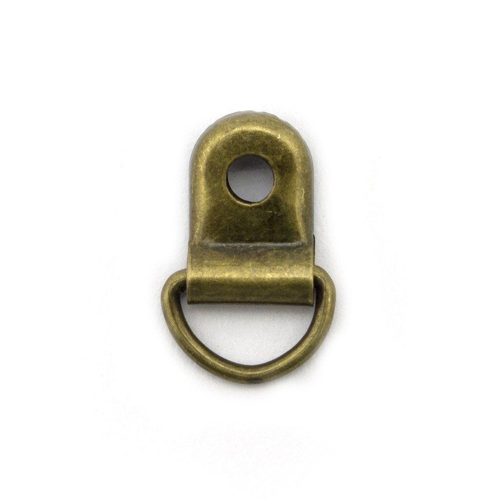 Pack of 20 antique gold metal shoe lace eyelets on display.