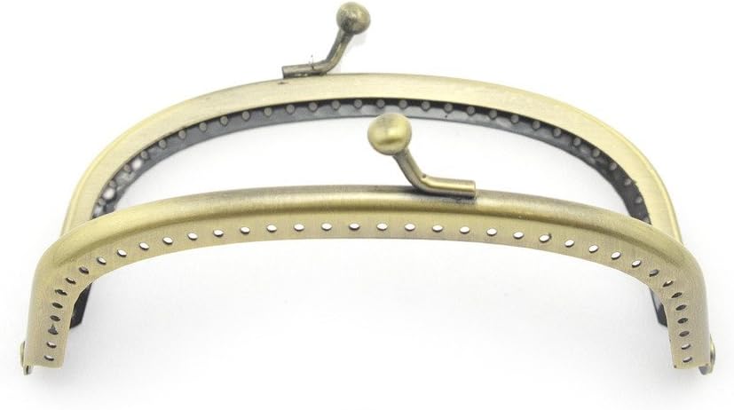 Close-up of decorative perforations on the purse frame.
