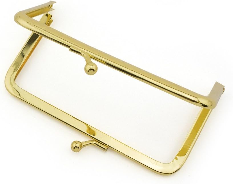 Close-up of the gold kiss clasp lock on the purse frame.
