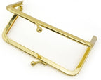 Close-up of the gold kiss clasp lock on the purse frame.