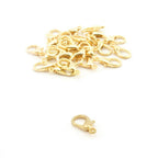 Pack of small gold colour lobster clasps for jewellery making.