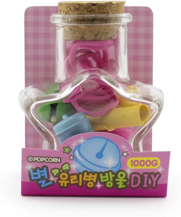 White jingle bells arranged in the star shaped bottle
