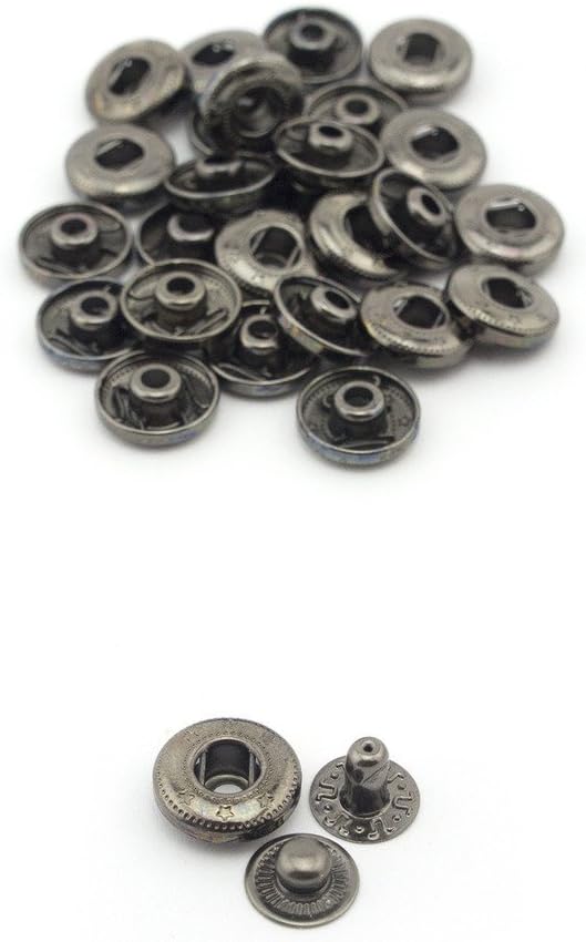 Display of press studs on a fabric background.