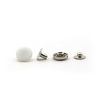 Pack of 20 white plastic press studs displayed