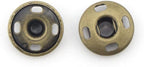 Close-up view of a 15mm vintage gold snap button showing its two parts.