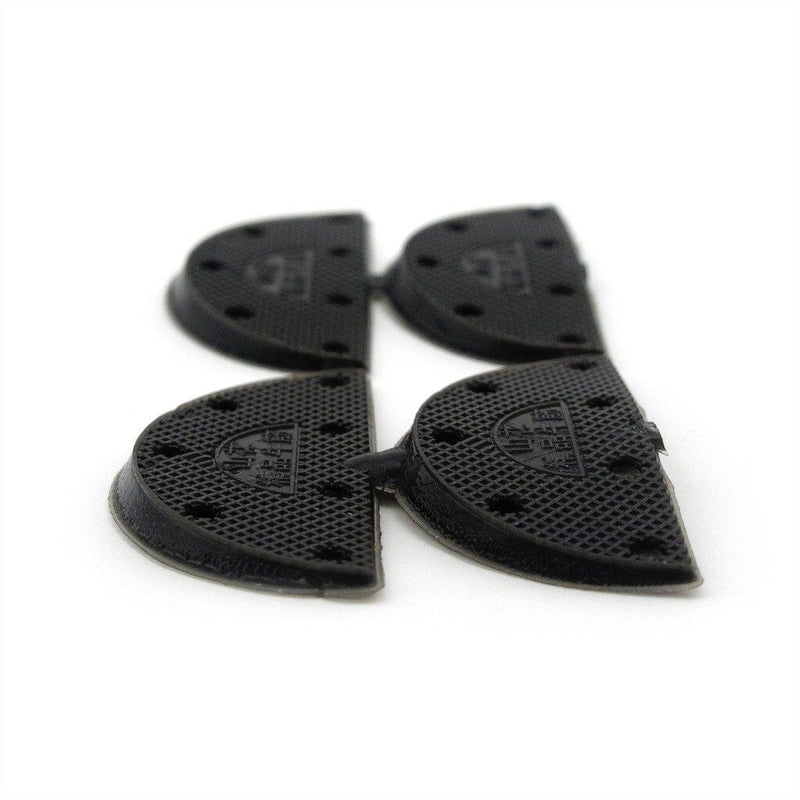 Two pairs of black rubber shoe pads displayed on a white background.