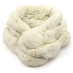White real rabbit fur scarf with pompom fastening displayed on a mannequin.
