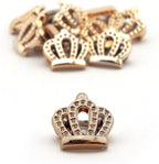 Close-up of gold colour crown charm showing detail