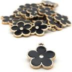 Close-up of the black enamel and gold flower embellishment.
