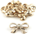 Close-up of gold colour bow shaped trim showing detail.