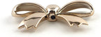 Gold bow shaped trims used on a dress for embellishment.