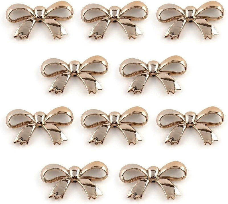 Pack of 20 gold colour bow shaped trims for embellishment.