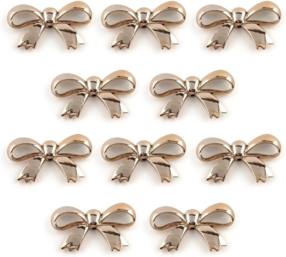 Large gold colour bow shaped trim on a white background.