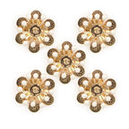 Gold and white enamel flower sew-on trim displayed on a white background.