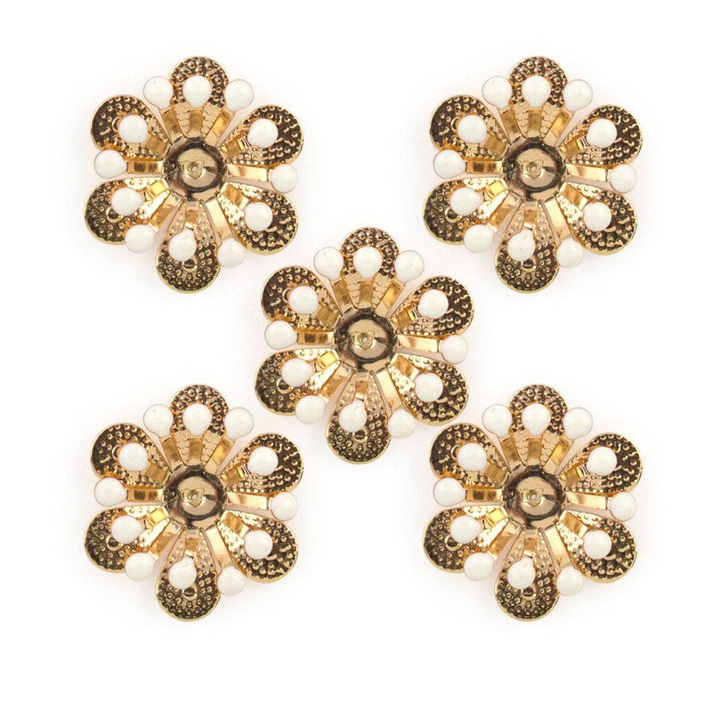 Gold and white enamel flower sew-on trim displayed on a white background.
