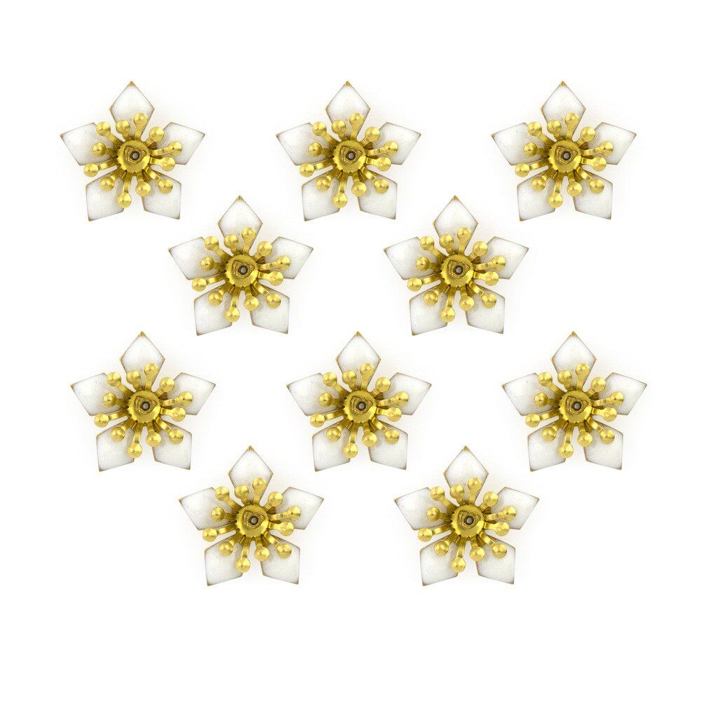 Close-up of white enamel and brass flower sew-on trim