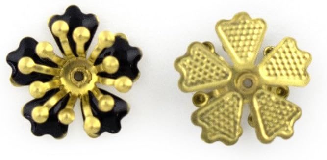 Close-up of black enamel and brass flower embellishment.