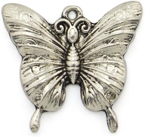 Butterfly pendants displayed on a crafting surface