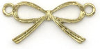 Close-up of a gold ribbon bow pendant showing detail.