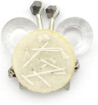 Close-up of the diamante and crystal flower trim on white felt.