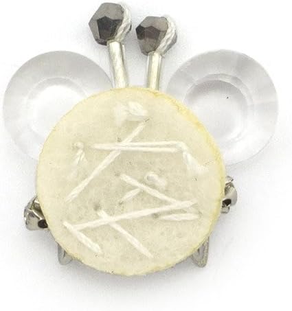 Close-up of the diamante and crystal flower trim on white felt.