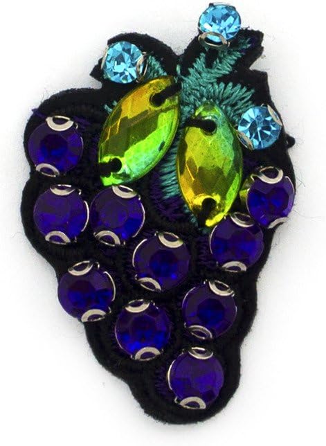 Close-up of diamonte details with purple, blue, and green crystals.