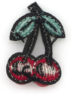 Close-up of red cherry trim featuring red beads.