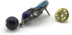 Brooch pins displayed on a neutral background
