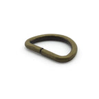 Pack of 10 antique brass D ring buckles displayed together