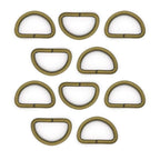 Antique brass D ring buckle on a white background