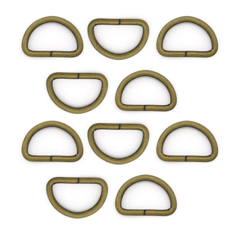 Antique brass D ring buckle on a white background