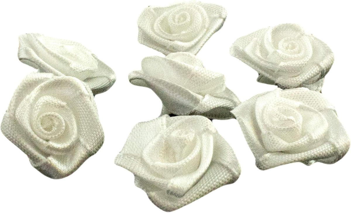 Close-up of a white roses fabric flower sew on trim, showing detail.
