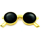 Three John Lennon dark sunglasses design brooches in black enamel and gold setting.